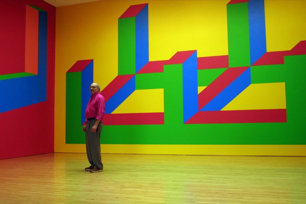 Sol Lewitt is dwarfed by his Wall Drawing No. 993. The photograph was taken at the Margo Leavin Gall